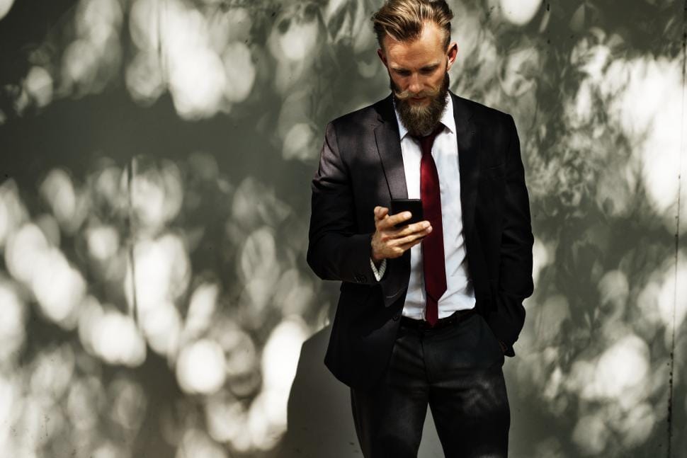 Traveller checking his phone while exploring a city