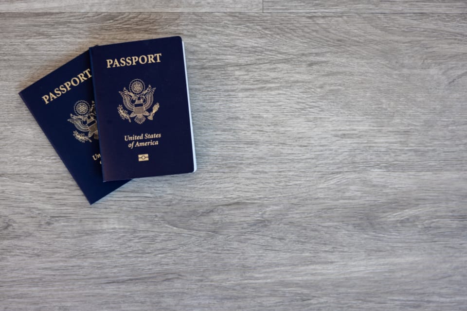 Passport on a table representing travel planning and refund policy checks