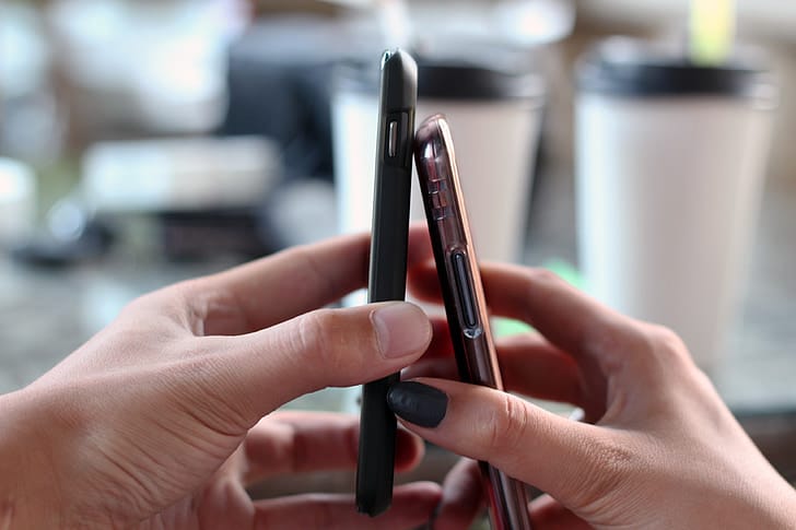 Hand holding a smartphone ready to install an eSIM profile