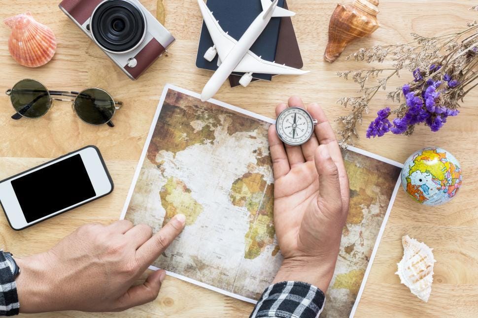 Travel planning with map, passport and phone for an eSIM trip