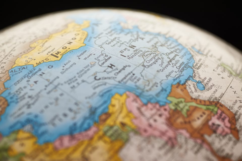 Colorful pins marking destinations on a world map